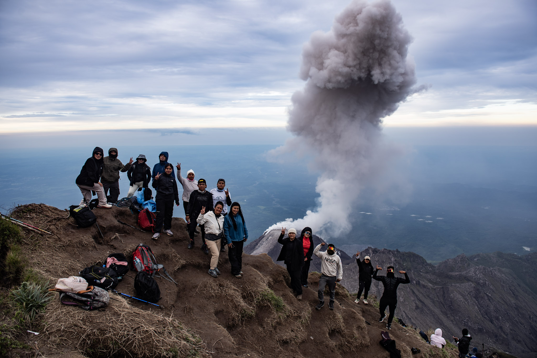 Our whole group posing in front of erupting Santiaguito.