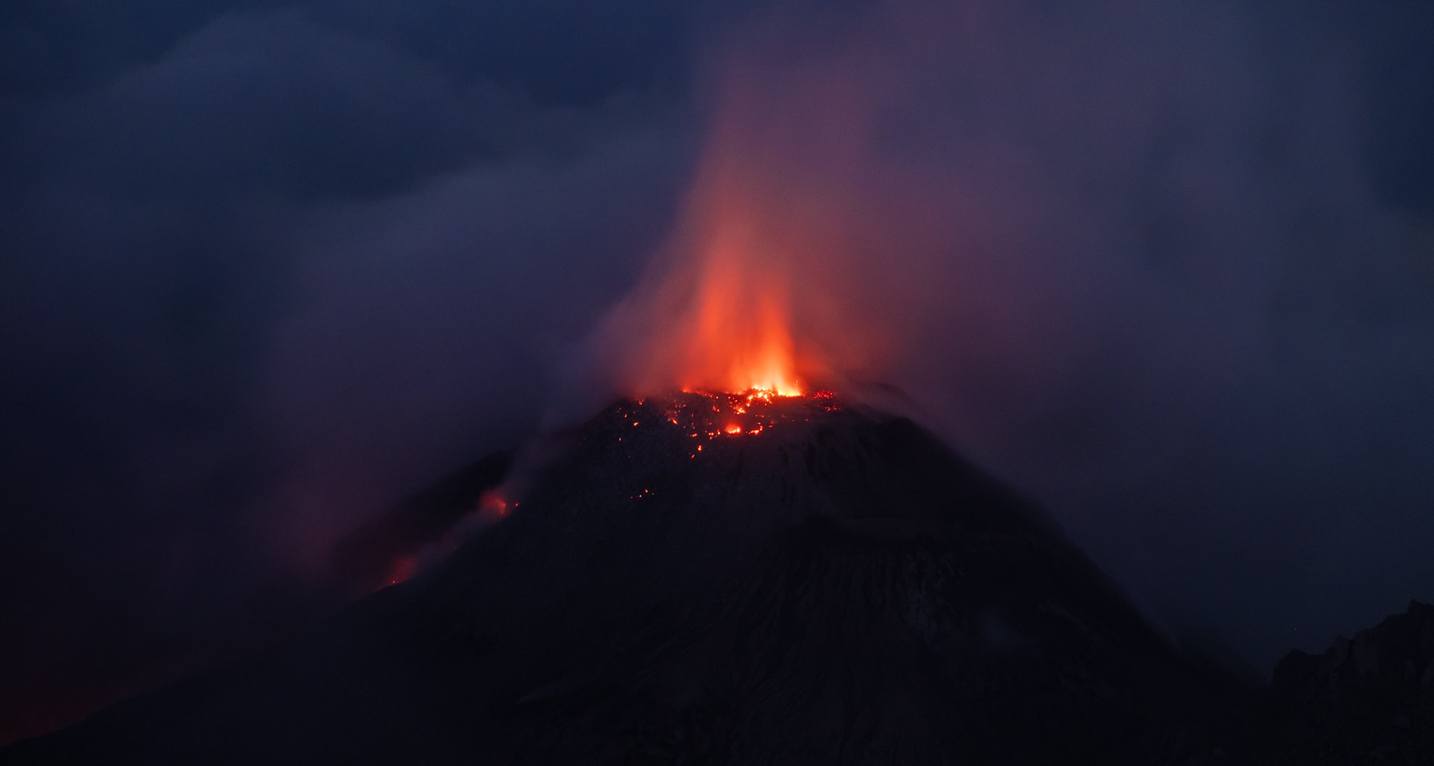 Santiaguito erupting in the clouds.